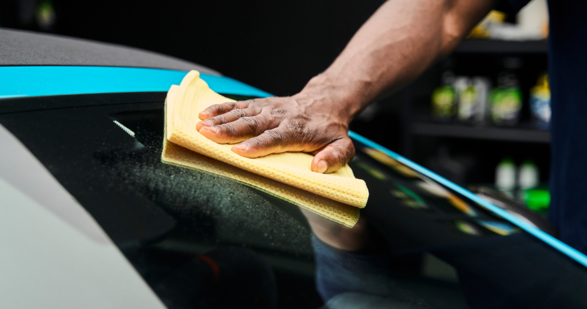 using-a-yellow-waffle-weave-microfiber-towel-from-the-rag-company-to-dry-and-polish-a-car-windshield-for-a-streak-free-finish-with-wipe-new-glass-clear-repellent.png
